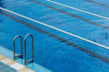 Swimming pool ladder and lane ropes