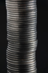 business finance. save money for investment concept coins on black background