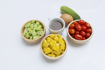 Sweet corn, cherry tomato, cucumber in wooden bowl with Japanese salad dressing