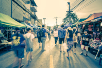 Obraz premium Blurred image of street market with retro color effected, blurre