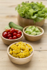 Vegetables in wooden bowl, healthy salad, diet food