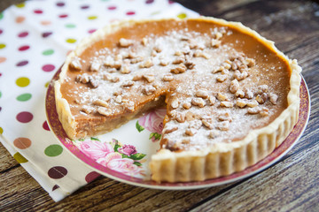 Homemade apple pie with nuts and dulce de leche