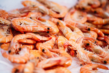 Close Up Fresh Shrimps On Display On Ice On Fishermen Market Store Shop