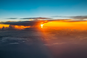 Fototapeta na wymiar Sunset Sunrise Over Mountains From Height Of Airplane, Plane