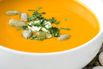 Pumpkin soup on a white wooden table

