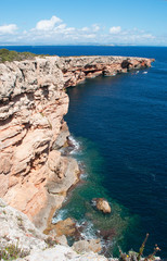Fototapeta na wymiar Formentera, Isole Baleari: vista della scogliera e delle rocce di Punta Prima, nella zona est dell'isola, l'11 settembre 2010
