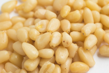 Close-up on Pine Nuts in white background