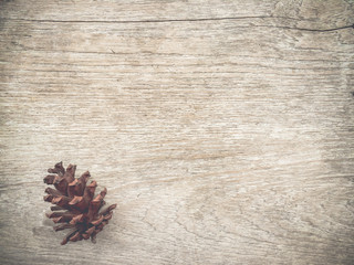wood background textured with pine cones.wooden table surface background with copy space.vintage style.