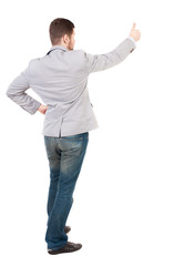 Back view of  business man shows thumbs up.   Rear view people collection. cheerful office worker shows positive emotions.  backside view of person.  Isolated over white background. A guy in a gray