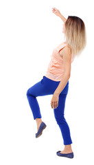 Balancing young woman.  or dodge falling woman. Rear view people collection.  backside view of person.  Isolated over white background. The blonde in a pink shirt leans back.