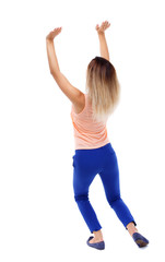 back view of woman  protects hands from what is falling from above. woMan holding a heavy load Rear view people collection.  backside view of person.  Isolated over white background. Blonde in blue