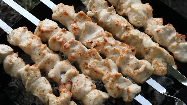 Barbecue skewers with meat on the brazier. Grill chicken shish kebab