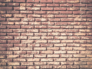 Red brick wall background textured.