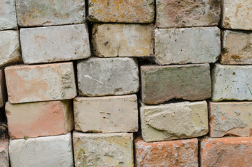 background of stacked old cement bricks