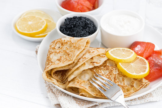 crepes with salted fish, sour cream and caviar