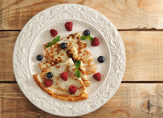 pancakes on a plate and berries - raspberries and blueberries, m