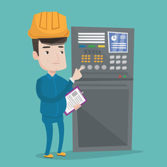 Engineer standing near control panel.