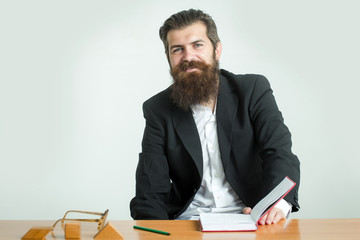bearded man teacher at table