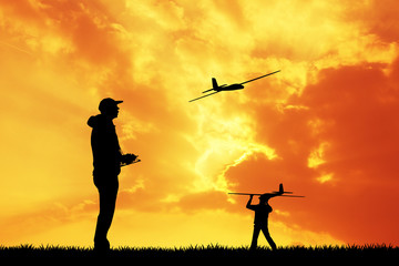 Fototapeta na wymiar remote controlled airplanes at sunset
