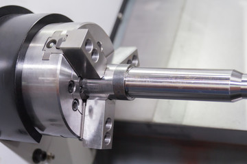 Steel metal cutting machine process by CNC lathe in workshop