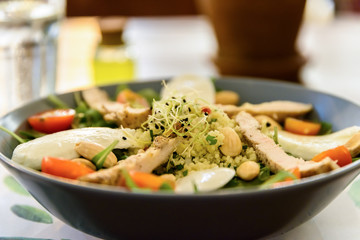 Fresh Salad With Mozzarella, Chicken, Tomatoes, Almonds And Onion Germs