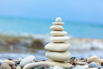 Pyramid of Stones near Sea on Beach