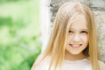 Fototapeta premium small girl with blonde hair outdoor