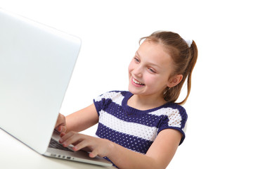 preteen girl using laptop on white background