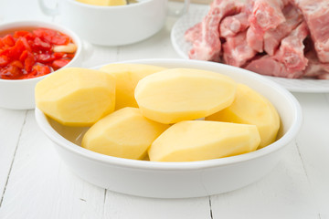 raw potatoes and other items ready to be cooked