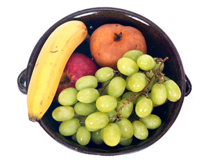 Organic fruits in berry bowl separated on white background