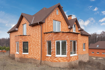 Beautiful new brick hoouse with plastic windows and  metal tiler roof