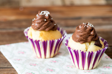 Vanilla cupcake with chocolate topping.