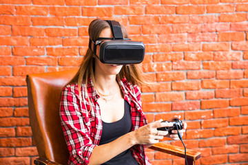 Fototapeta na wymiar Woman in virtual reality glasses playing the game