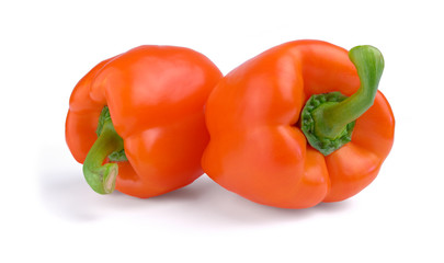 Two red sweet peppers isolated on white