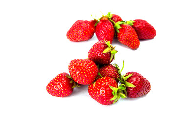 Fototapeta na wymiar Ripe red strawberries on a white background