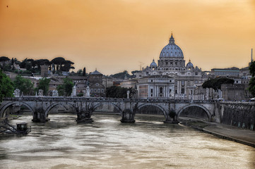 Fototapeta na wymiar Sunset on the river Tiber with a view of the Basilica of St. Peter in Rome.