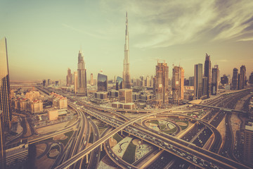 Naklejka na ściany i meble Dubai skyline with beautiful city close to it's busiest highway on traffic