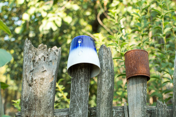 Cup hanging on the wooden fence, Ukraina