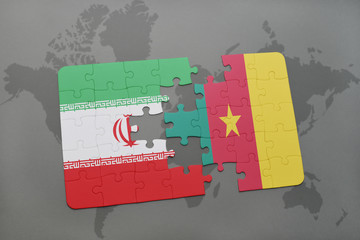 puzzle with the national flag of iran and cameroon on a world map background.