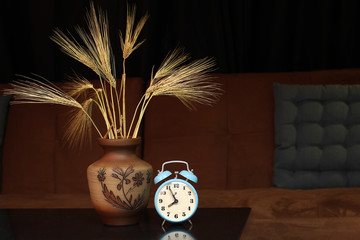 Alarm clock and a vase with ears