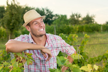 Happy male farmer at the vineyard