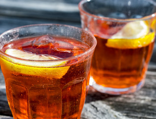 Two refreshing glasses of Spritz on wood