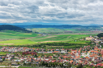 Fototapeta na wymiar Panoramic view of the fields, High Tatra mountains and the town Spisske Podhradie in Slovakia