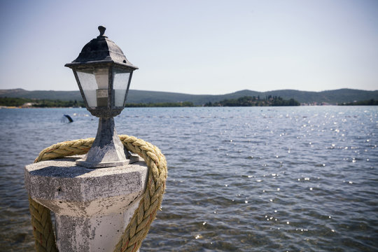 Fototapeta old lantern, sea view