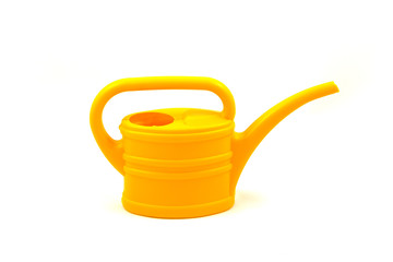 Yellow watering can isolated on a white background, closeup