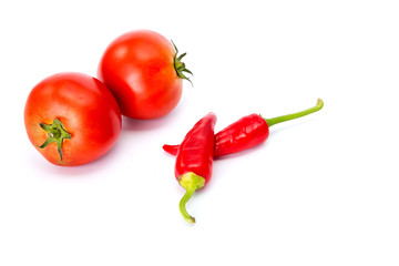  tomatoes and hot peppers white background