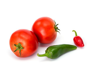  tomatoes and hot peppers white background