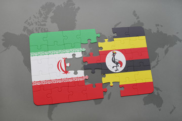 puzzle with the national flag of iran and uganda on a world map background.