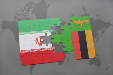 puzzle with the national flag of iran and zambia on a world map background.