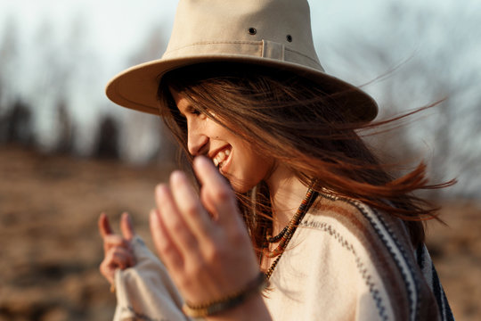 beautiful boho woman hipster portrait, smiling, wearing hat and